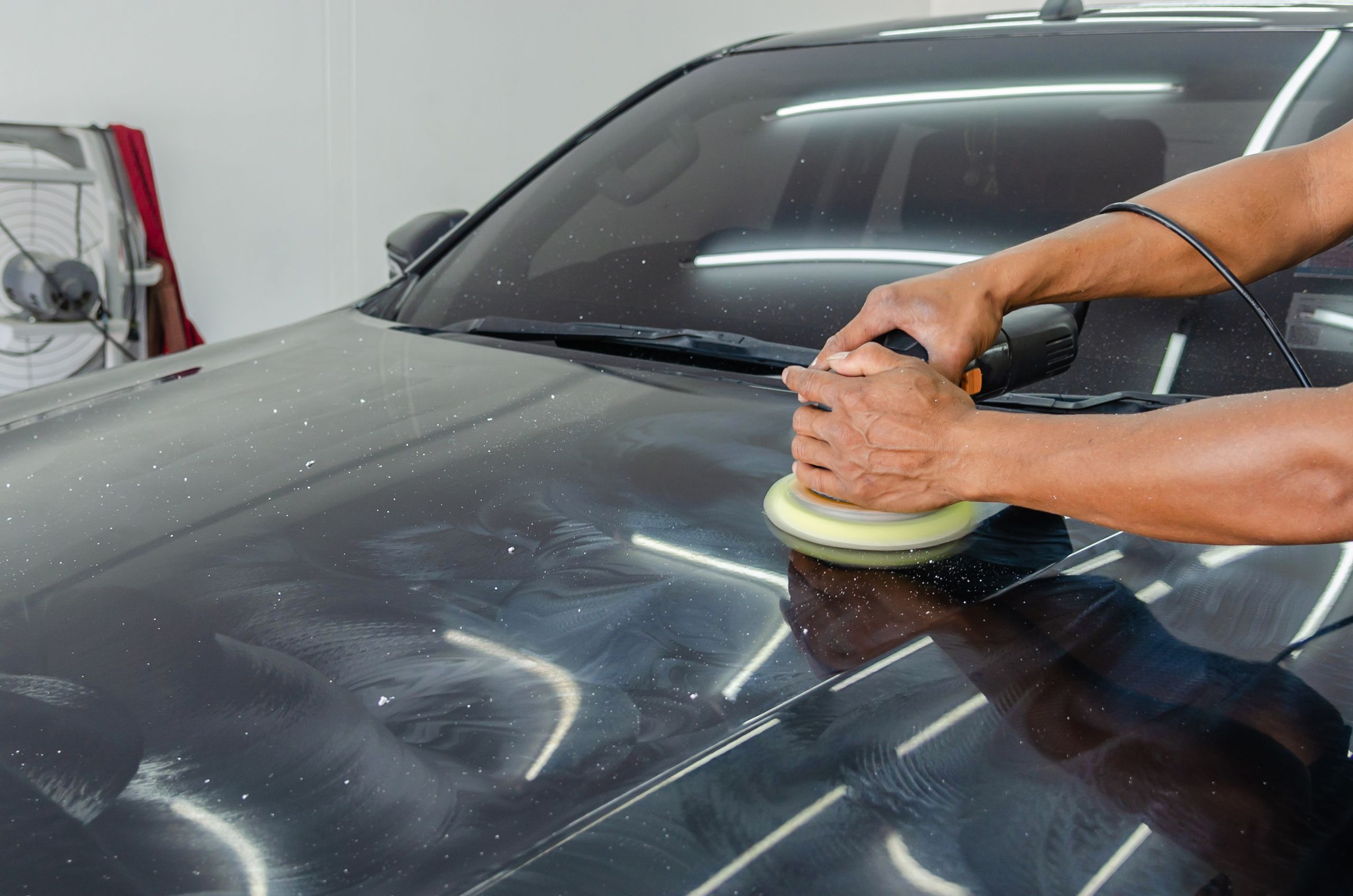 Automotive paint repair process including sanding, preparation, refinishing, and final polishing for a factory-quality finish