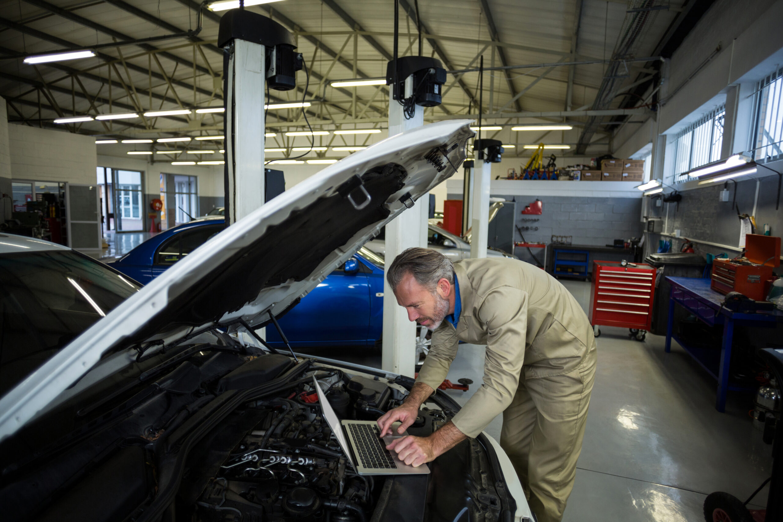OEM parts and diagnostic equipment in an auto body repair bay